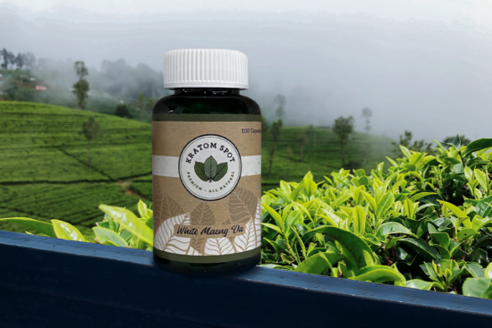 A Bottle of White Vein Kratom Capsules on a Rural Patio