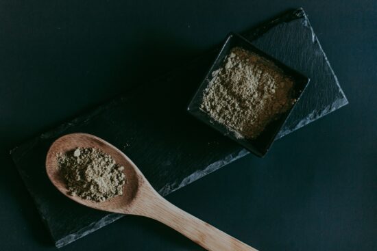 Kratom powder in a spoon
